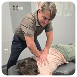Chiropractor Carry NC Brian Walker Adjusting Patient